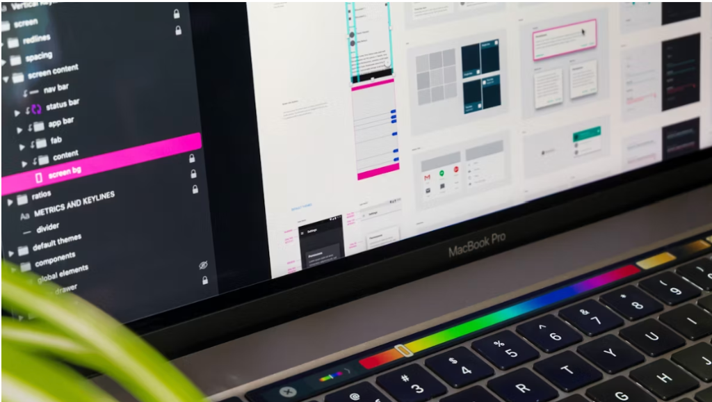 MacBook Pro displaying digital tools and computer icons, symbolizing integrated technology and web solutions for small businesses.